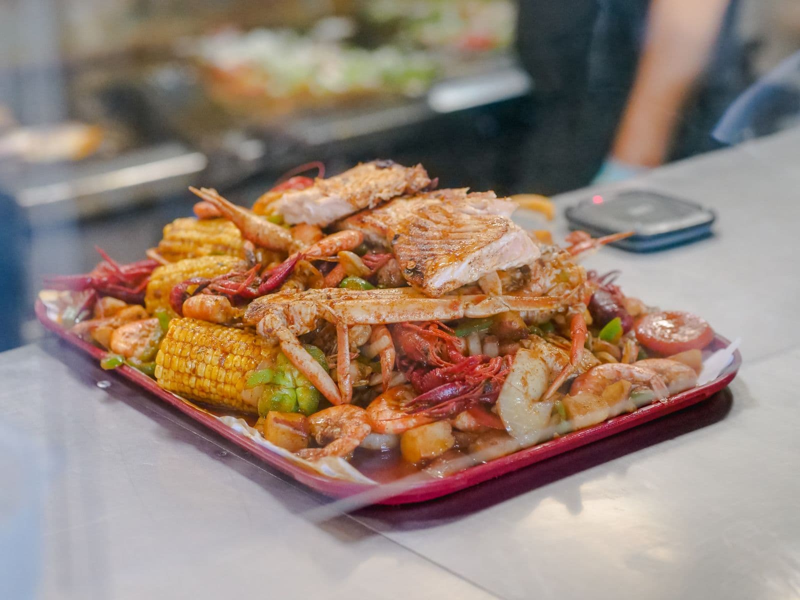 Cajun seafood boil with crab legs, shrimp, corn and potatoes